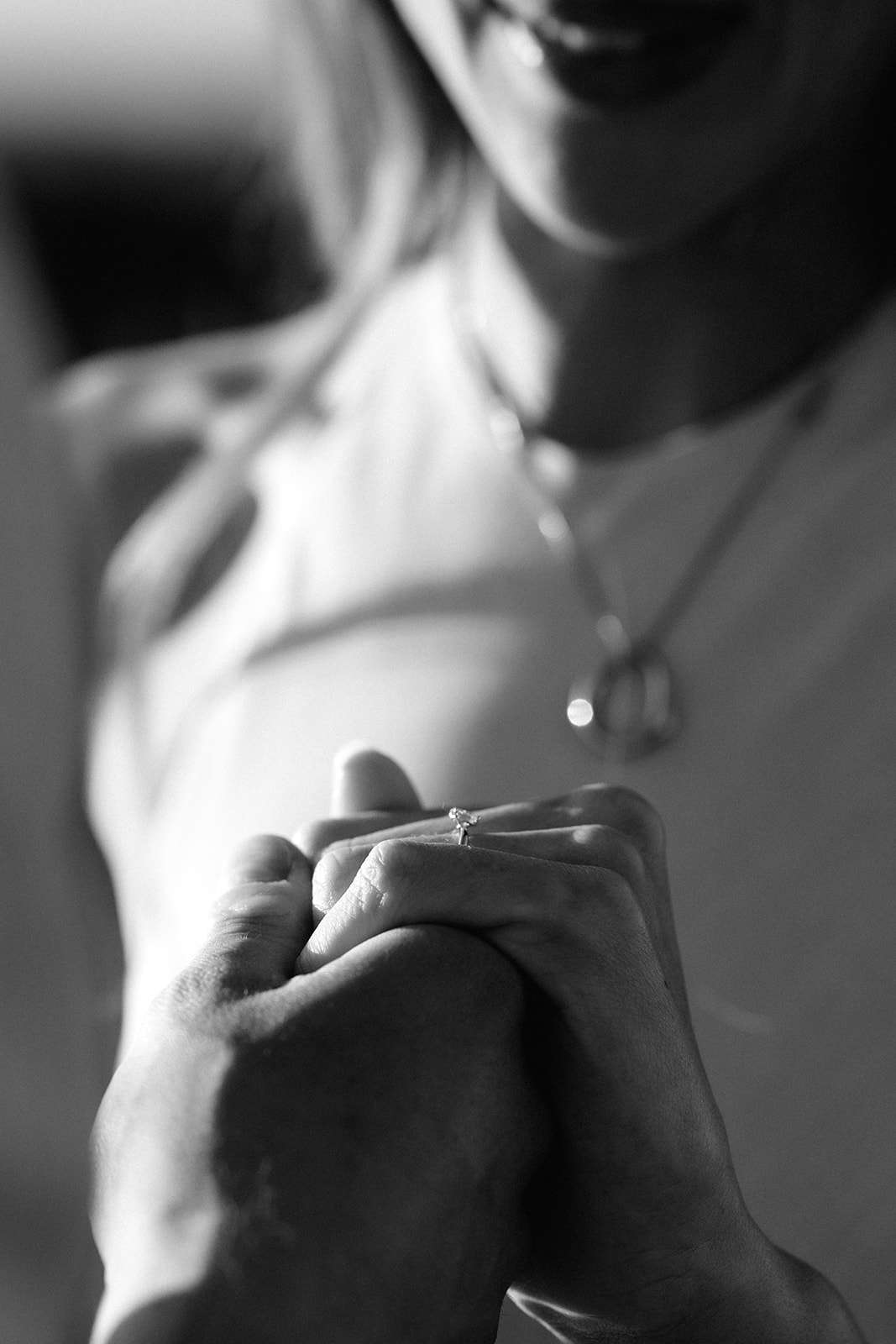 Black and white detail of a bride’s hands
